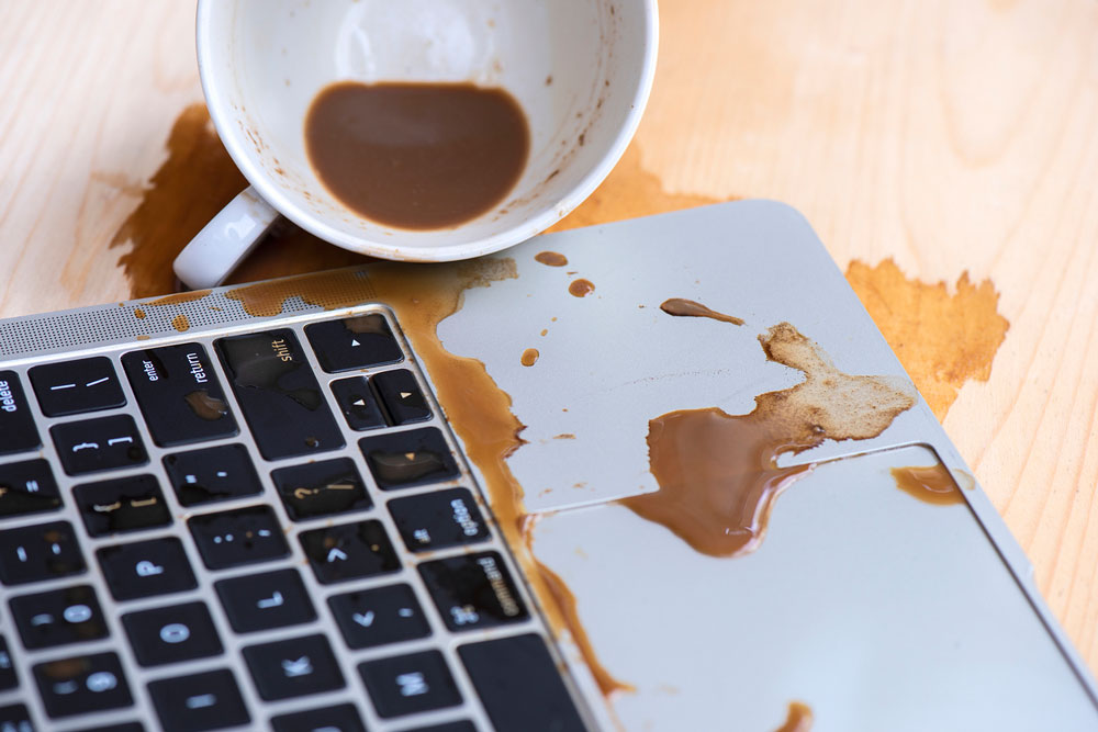 spilled coffee on laptop computer